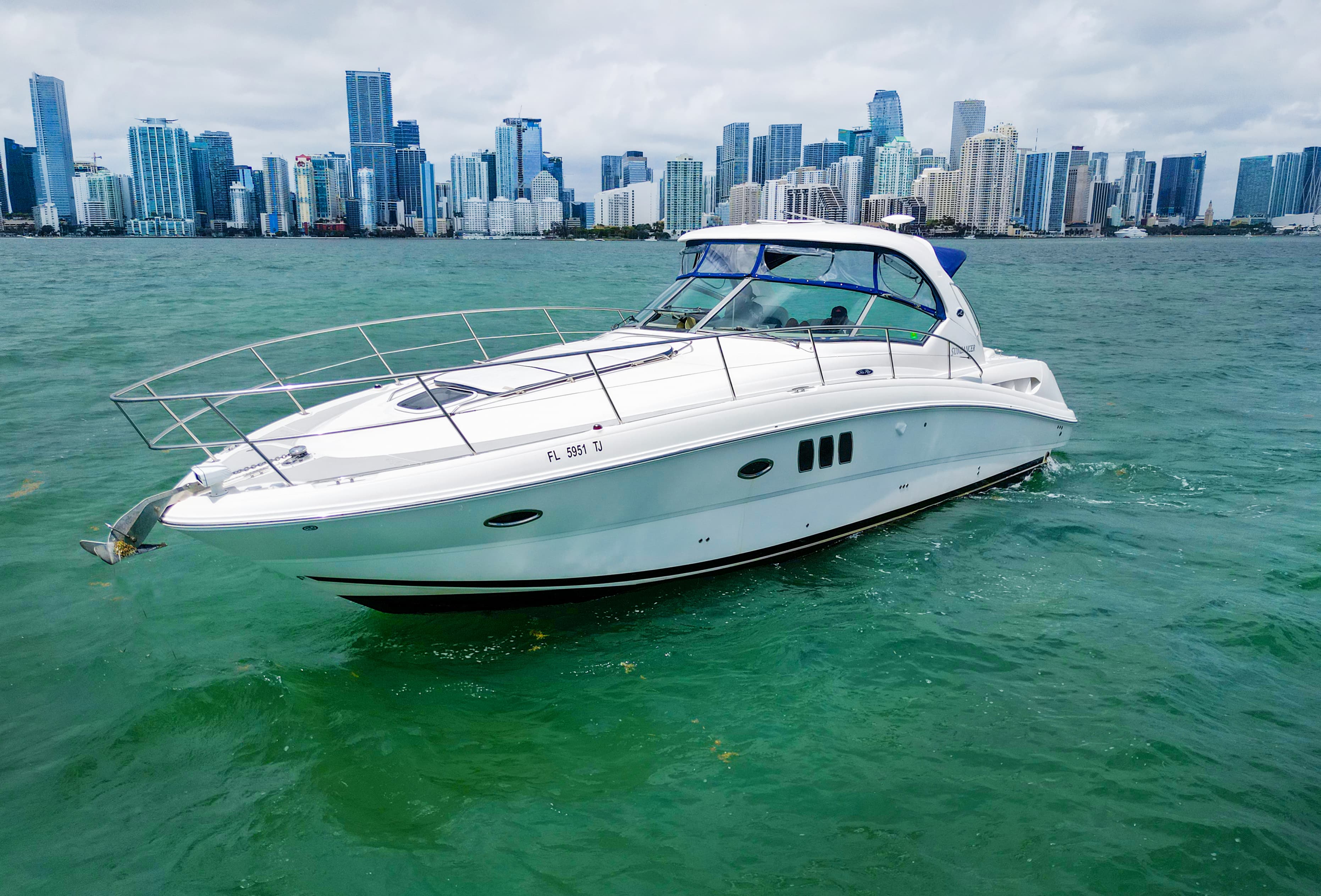 Yacht cruising Biscayne Bay with the Miami skyline